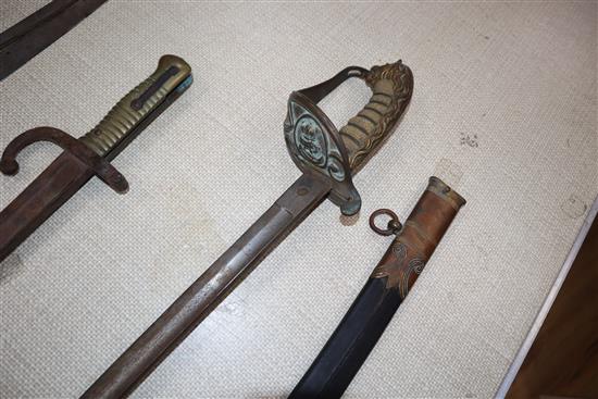 Two officers swords and a bayonet